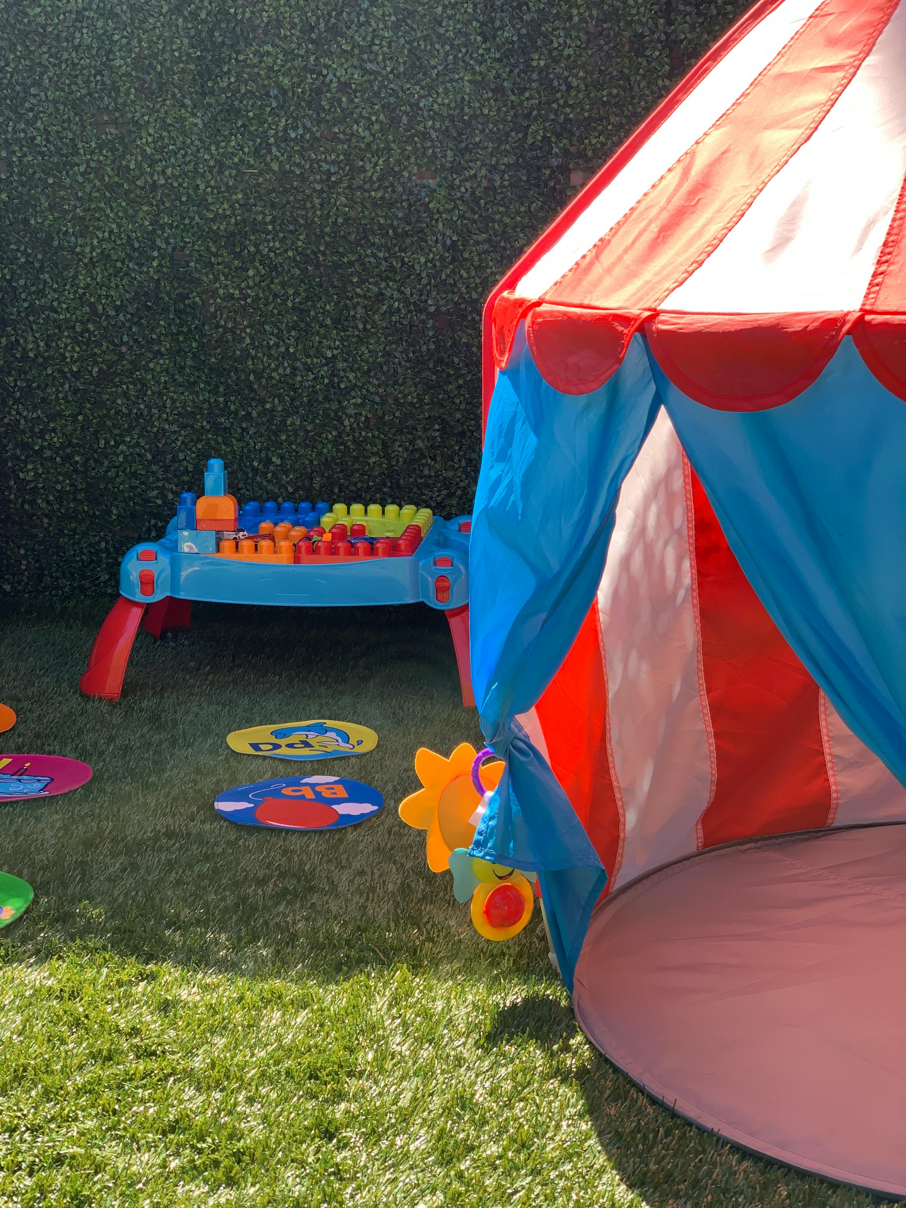 Play tent and activity table on grass