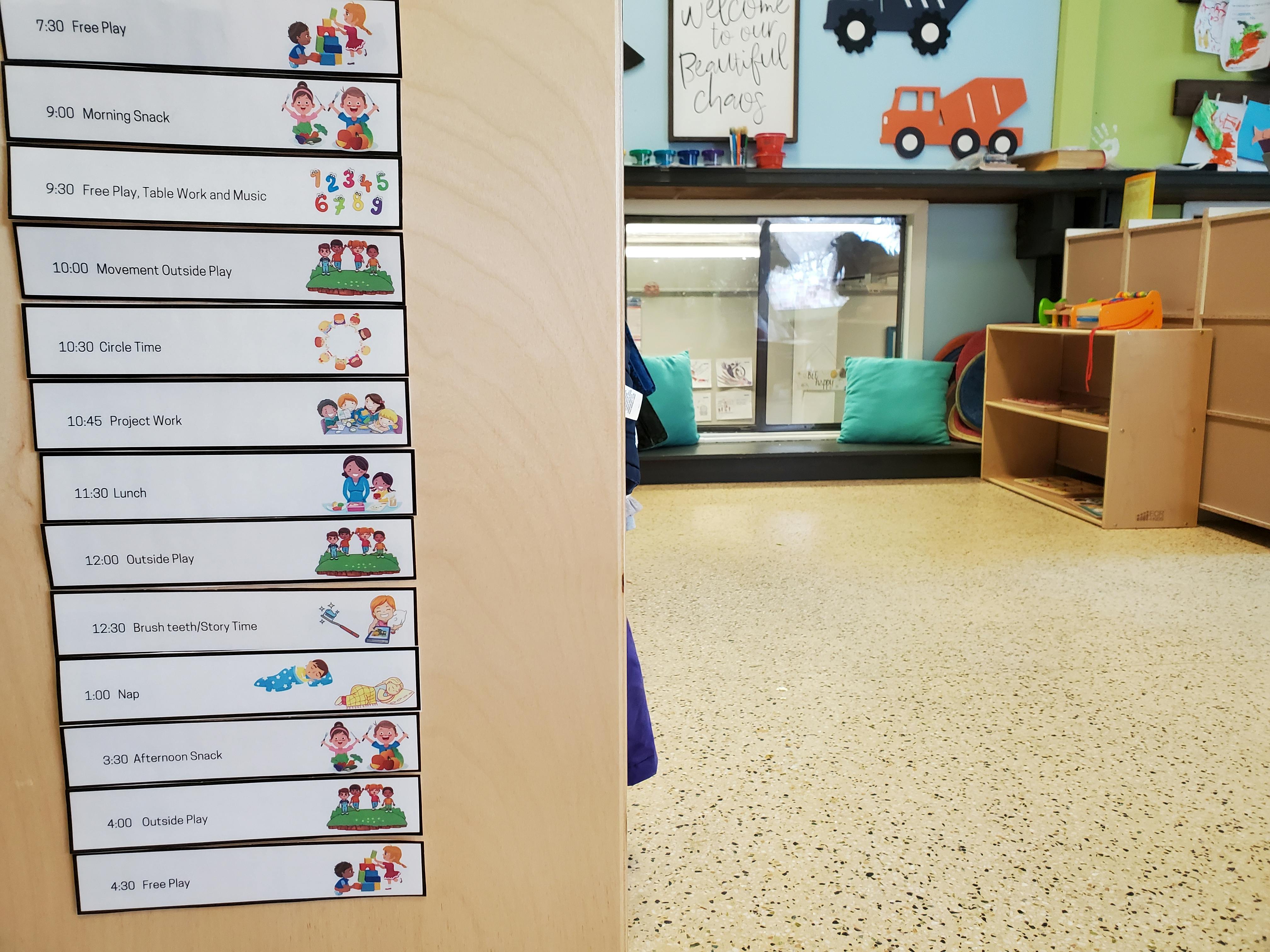 Labels with illustrations of children on a wooden surface in a classroom