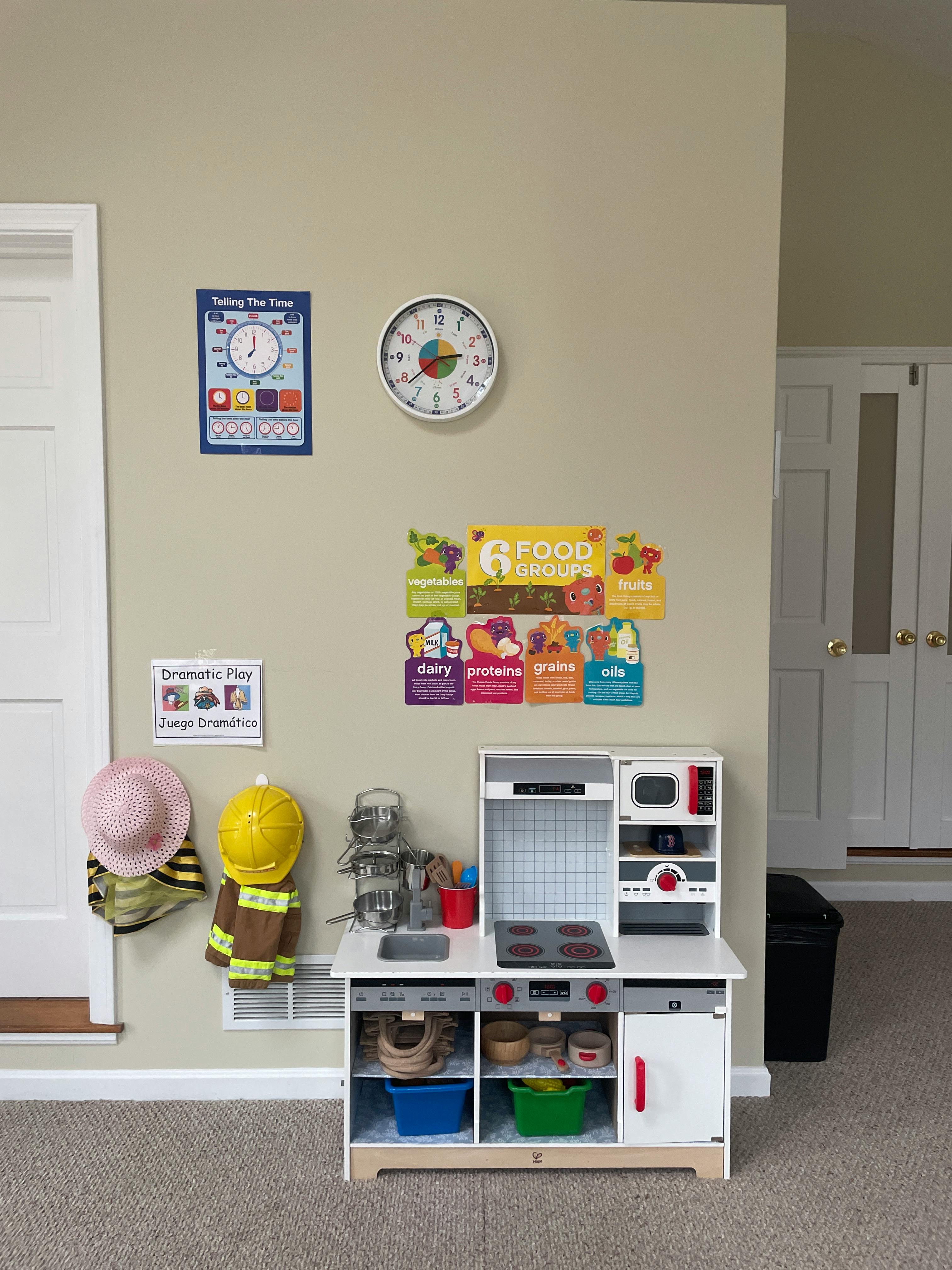 Child's play kitchen with toy food and kitchenware