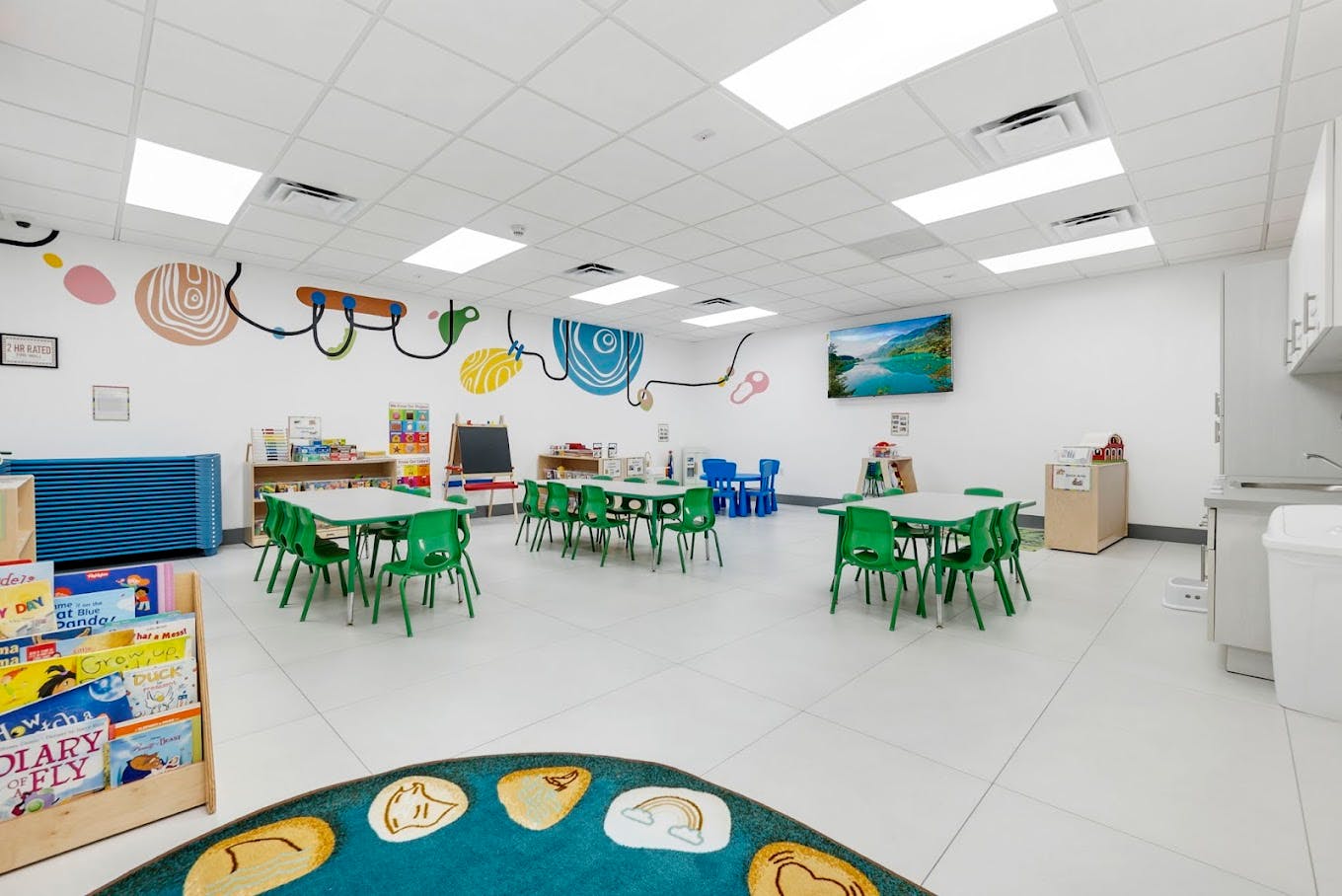Empty classroom with small tables and chairs