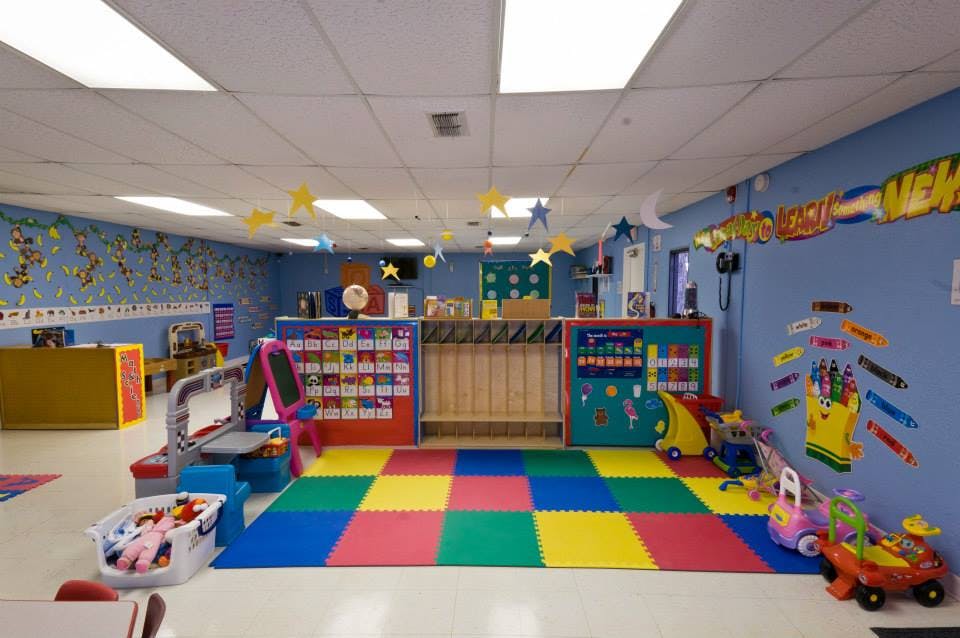 Playroom with colorful floor mats and toys