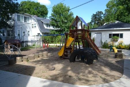 Outdoor playground with slides, swings, and climbing structures