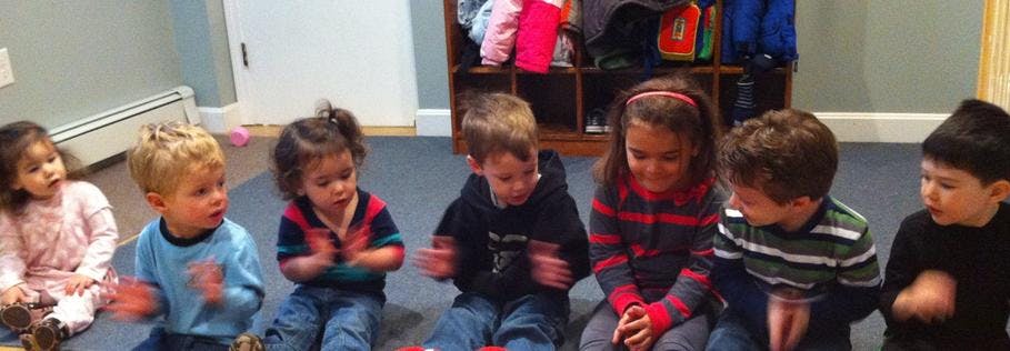 Six children sitting on the floor