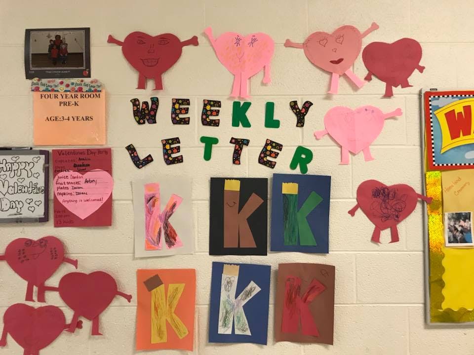 Classroom bulletin board with heart cutouts and a "Weekly Letter" sign