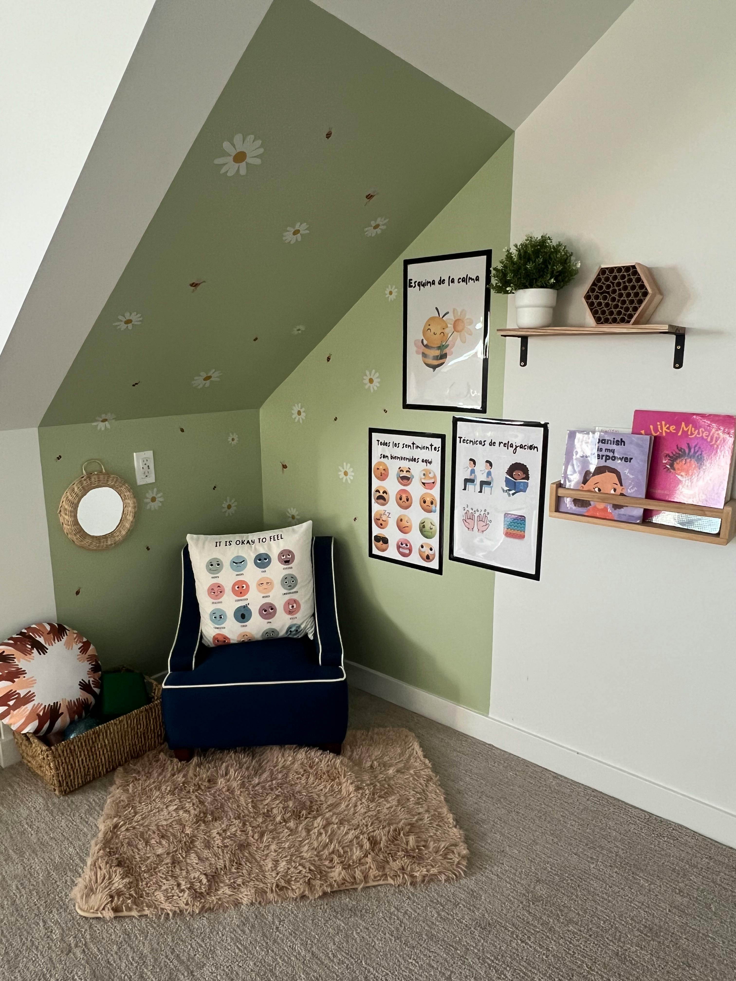 Child's room with a blue chair, patterned pillow, and educational posters