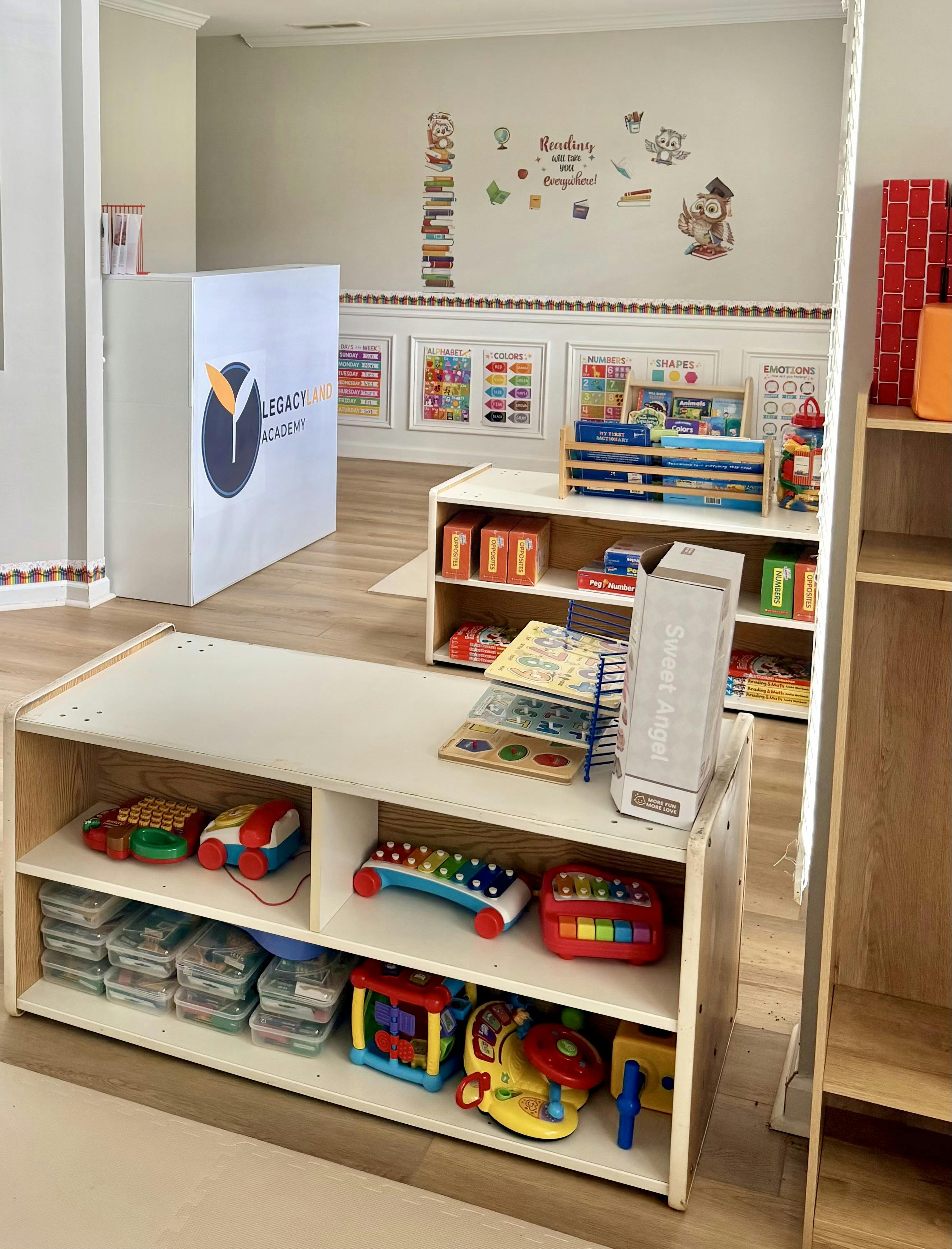 Classroom with shelves of educational toys and learning charts on the walls