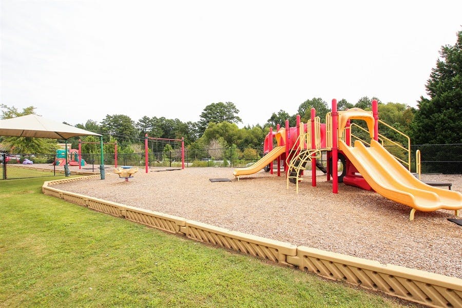 Empty playground with slides and swings