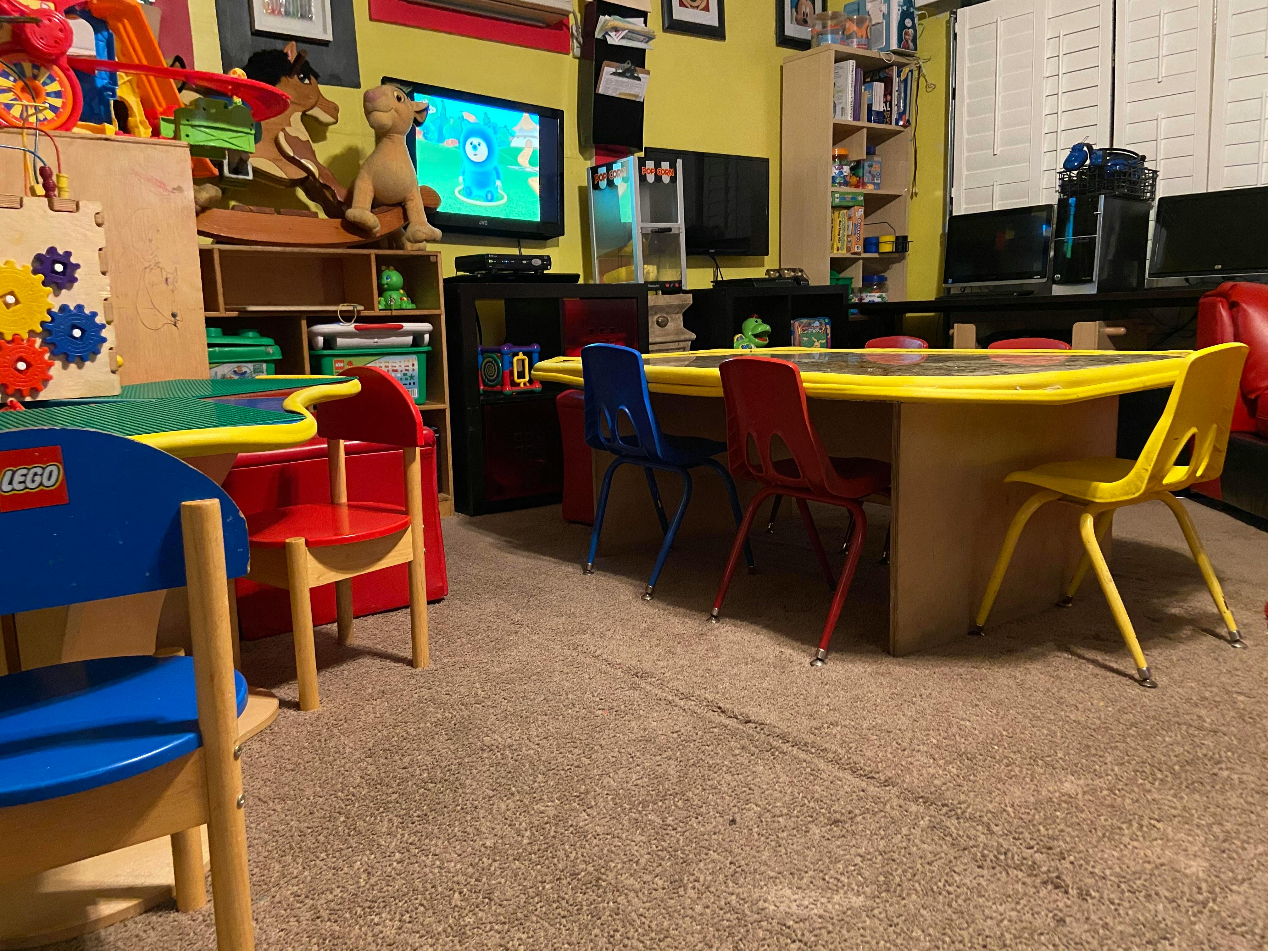 Children's play area with tables and chairs