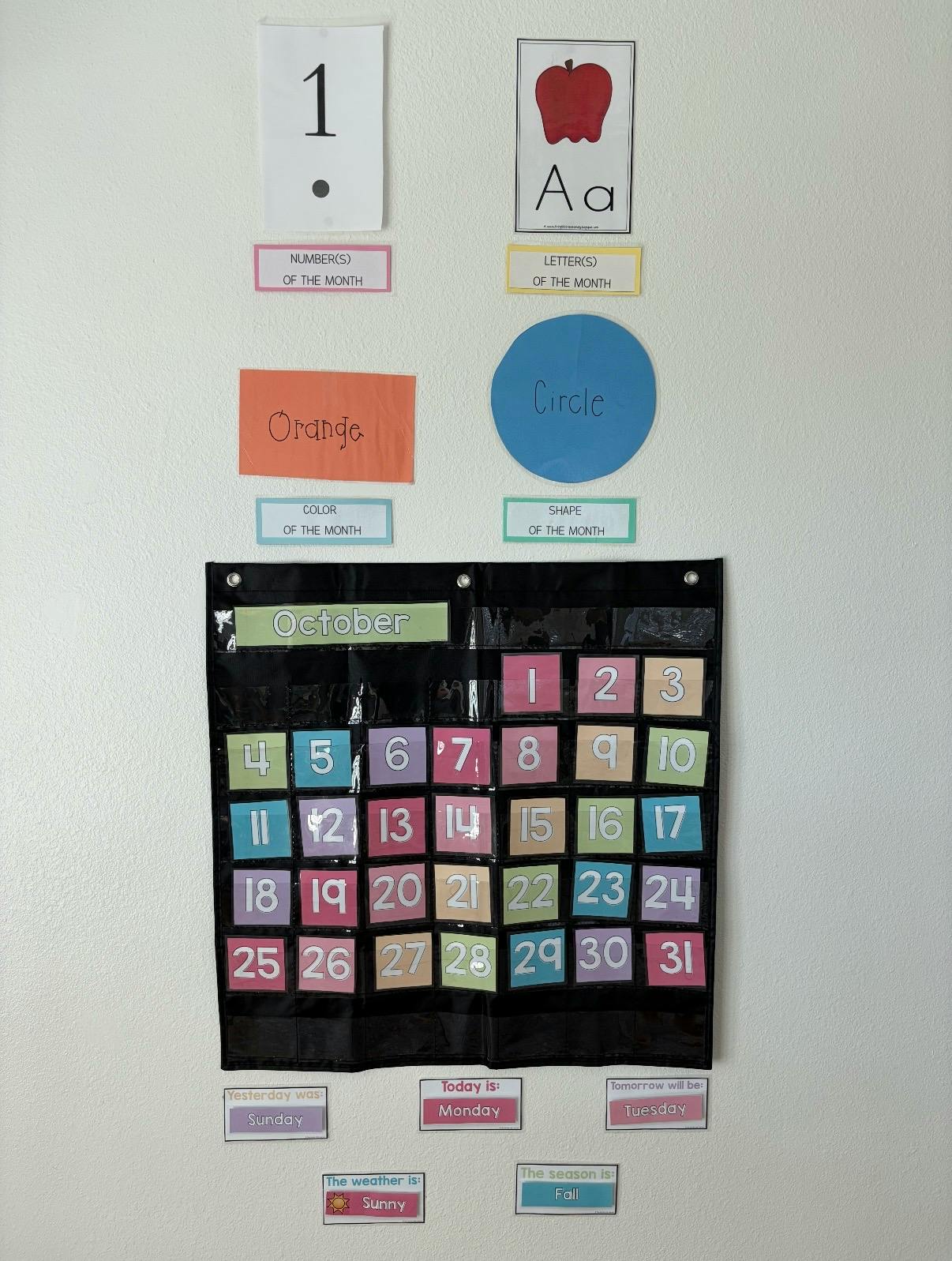 Educational wall calendar and learning charts for October