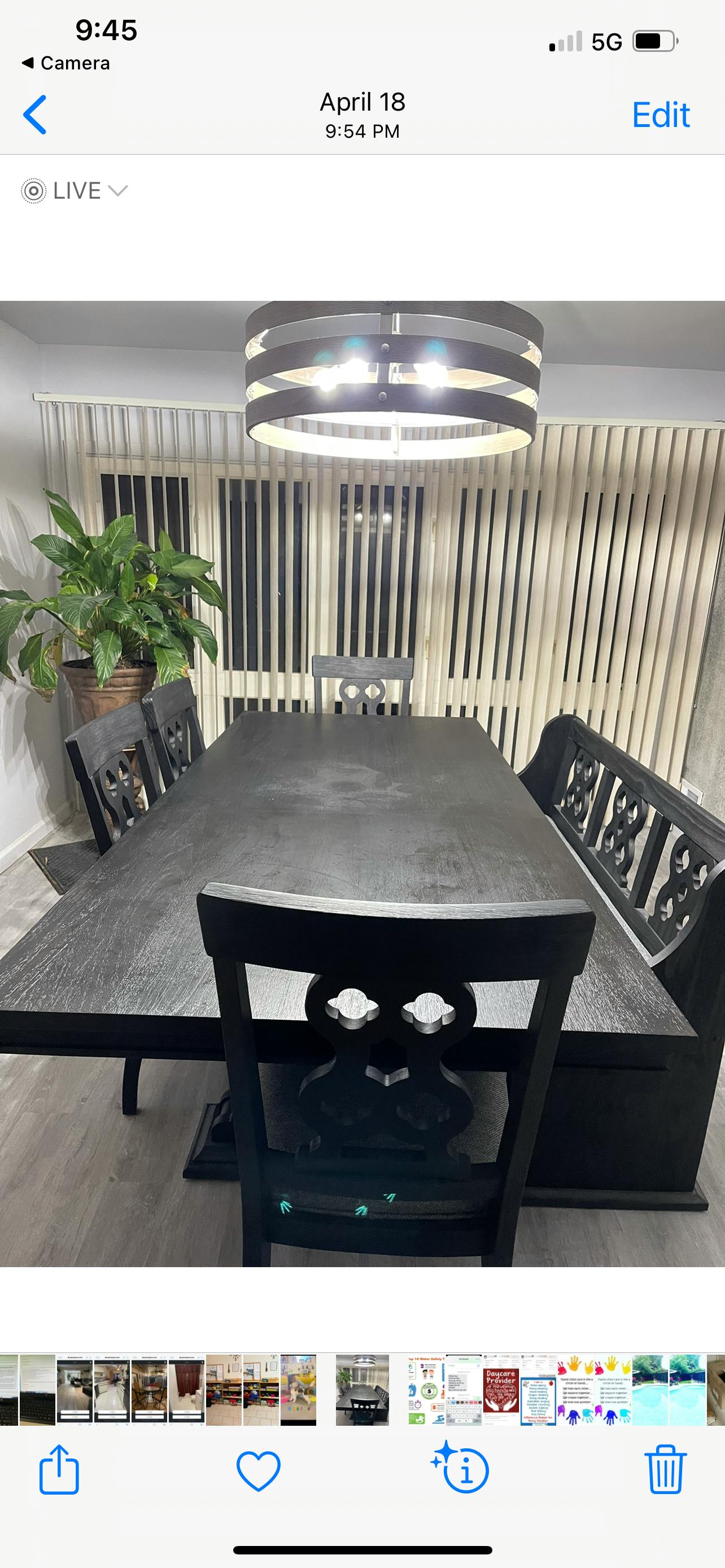 Dining room with a dark wood table, chairs, and a bench