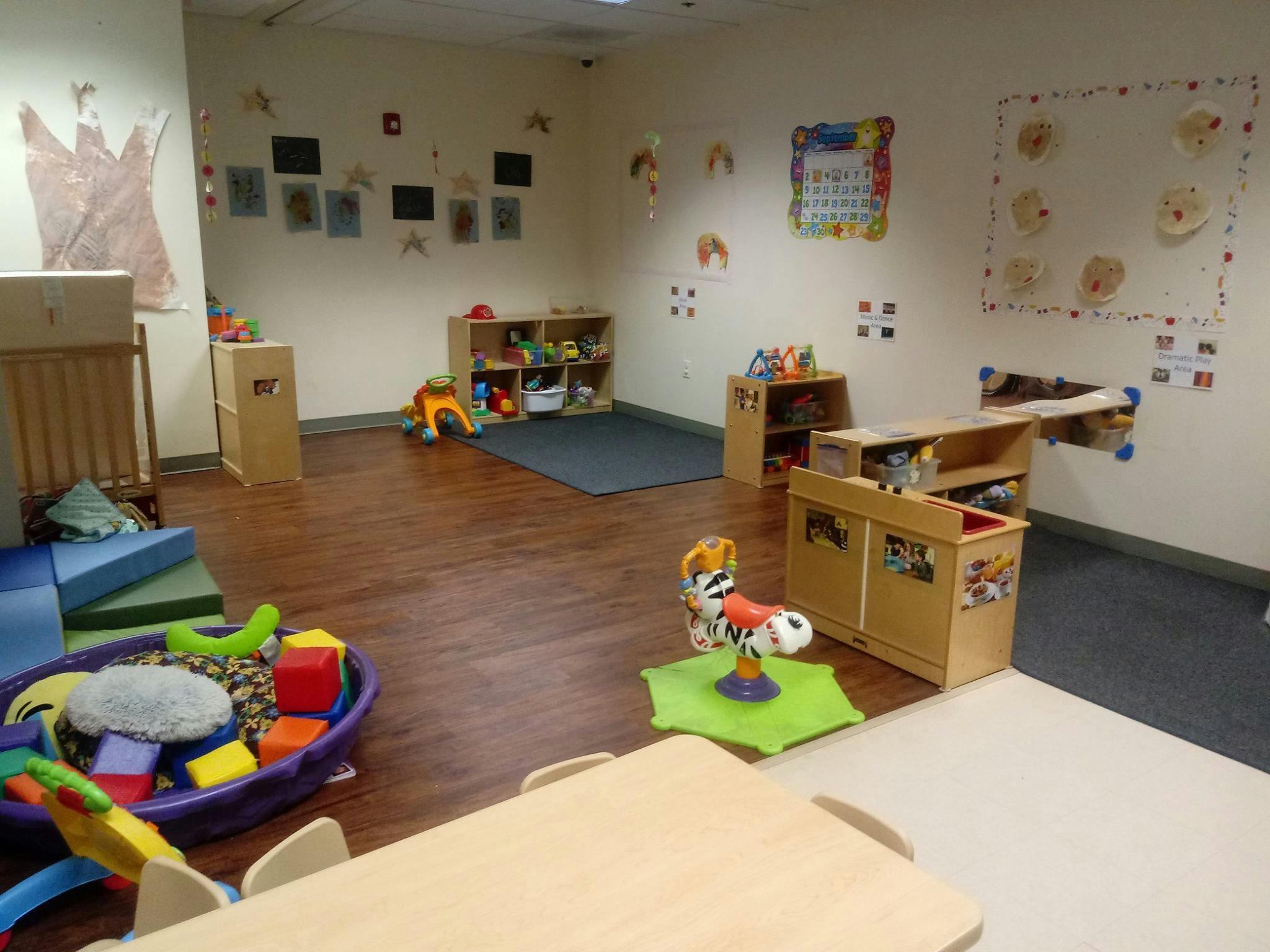 Playroom with toys, shelves, and wall decorations