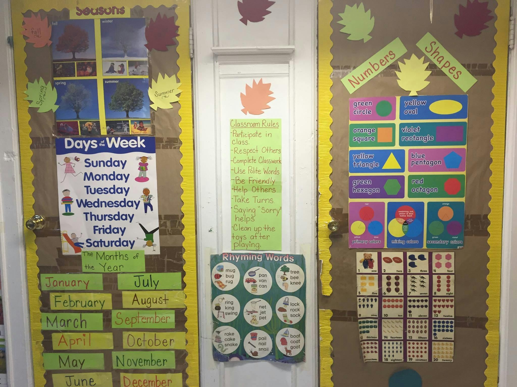 Classroom bulletin boards with learning materials for seasons, days of the week, numbers, and shapes