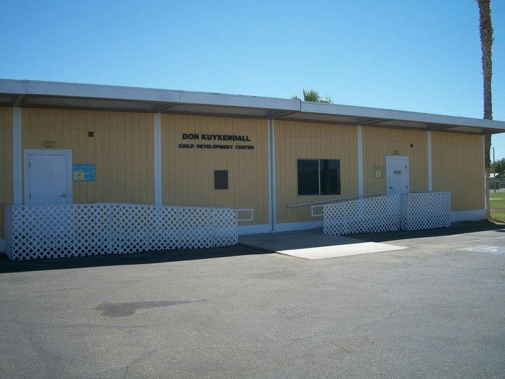 Exterior of a building with "DON RIVERSIDE" and "CHILD DEVELOPMENT CENTER" on the wall