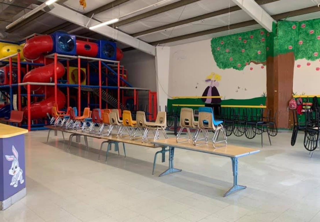 Indoor playground with tables and chairs