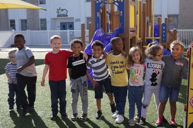 Group of children standing on a playground