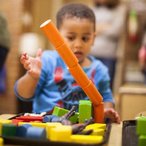 Child playing with building blocks