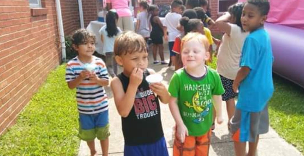 Children eating snacks outdoors