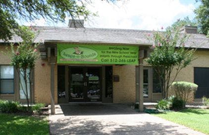 Building exterior with a green banner above the entrance
