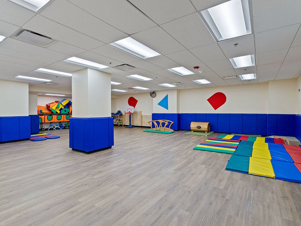 Empty children's playroom with colorful soft play equipment