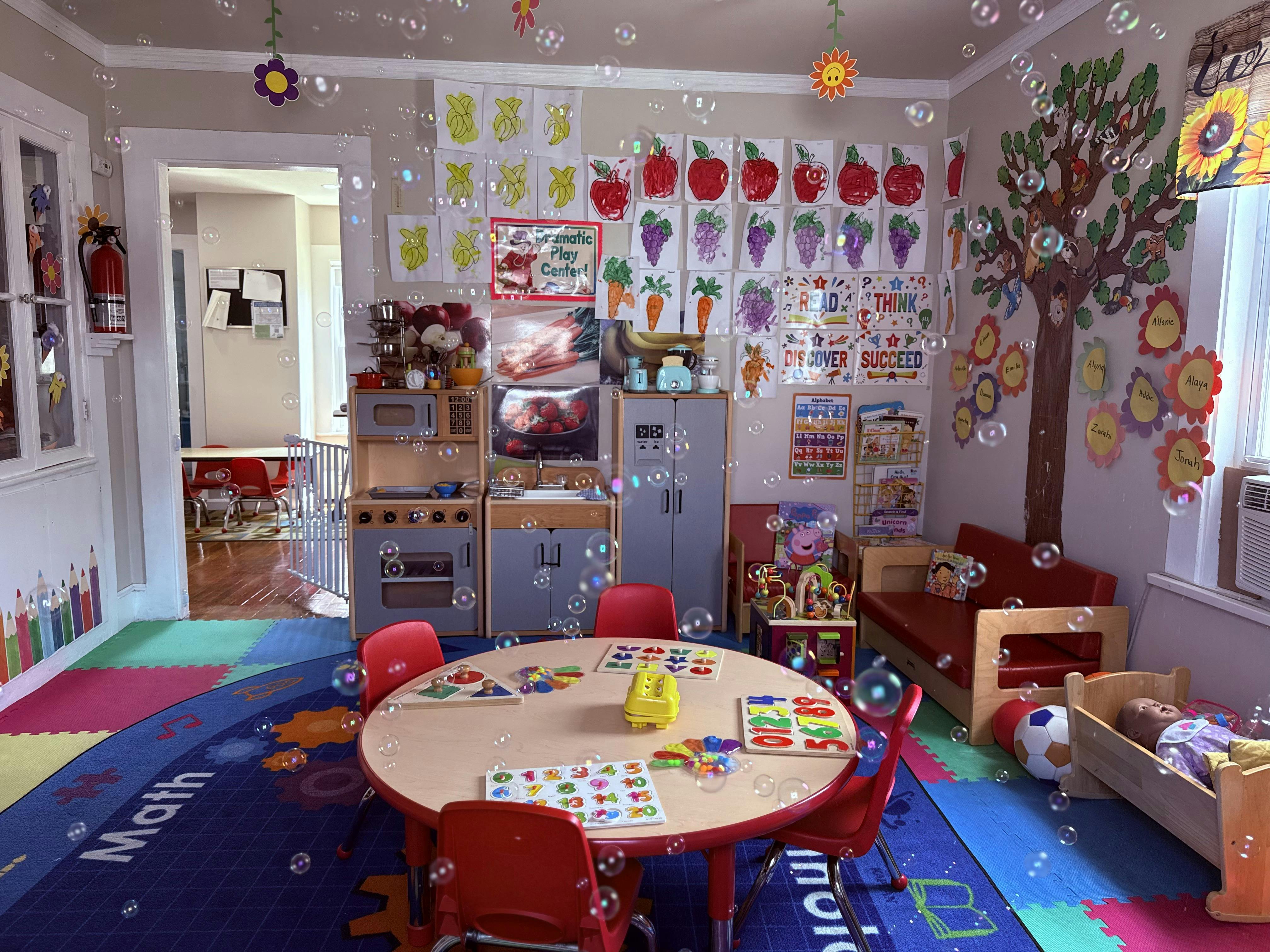 Bubbles floating in a brightly decorated child care classroom