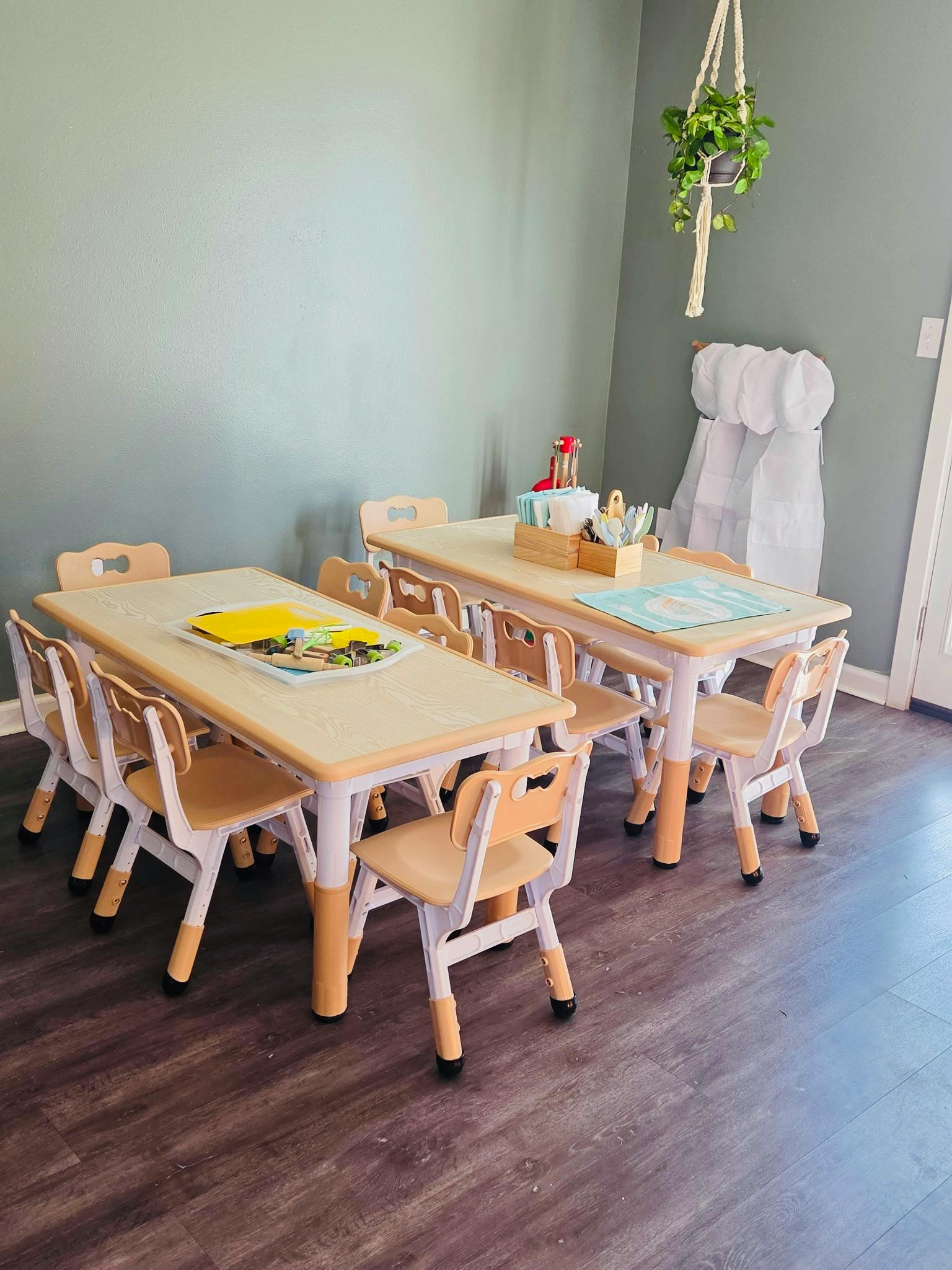 Child-sized tables and chairs in a classroom setting