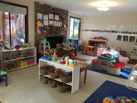 Playroom with shelves of toys and a small table