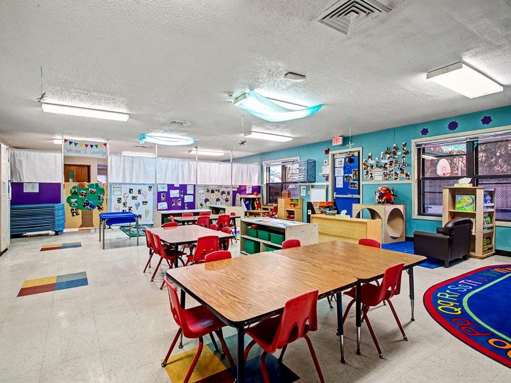 Classroom with child-sized tables and chairs