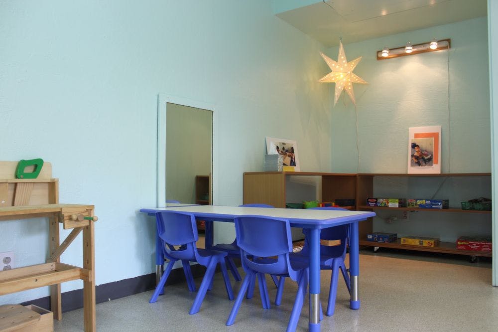 Classroom with blue tables and chairs