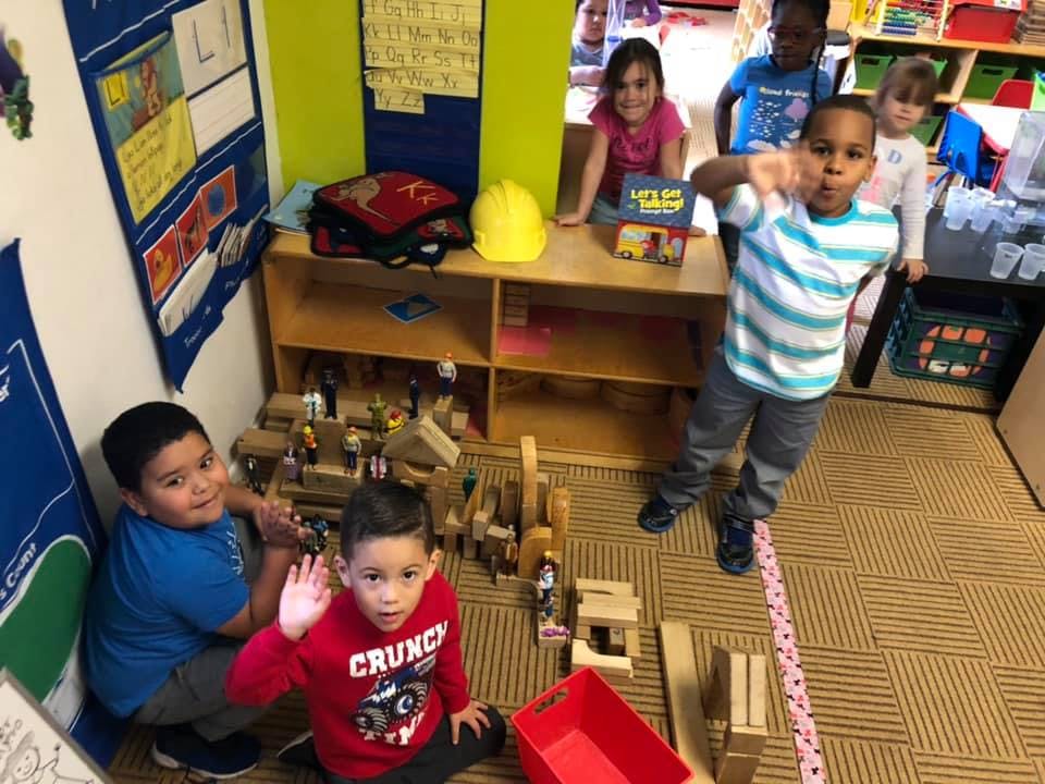 Children playing with blocks in a classroom