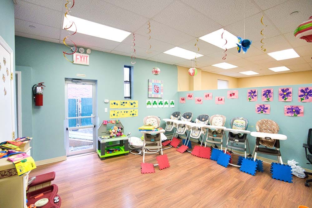Daycare room with high chairs and decorations
