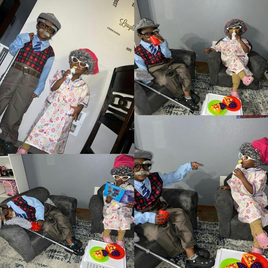 Children dressed as older people, one holding a cup and the other a book