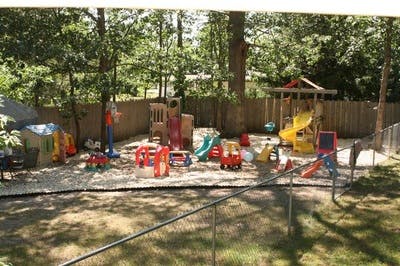 Outdoor playground with various play structures and toys
