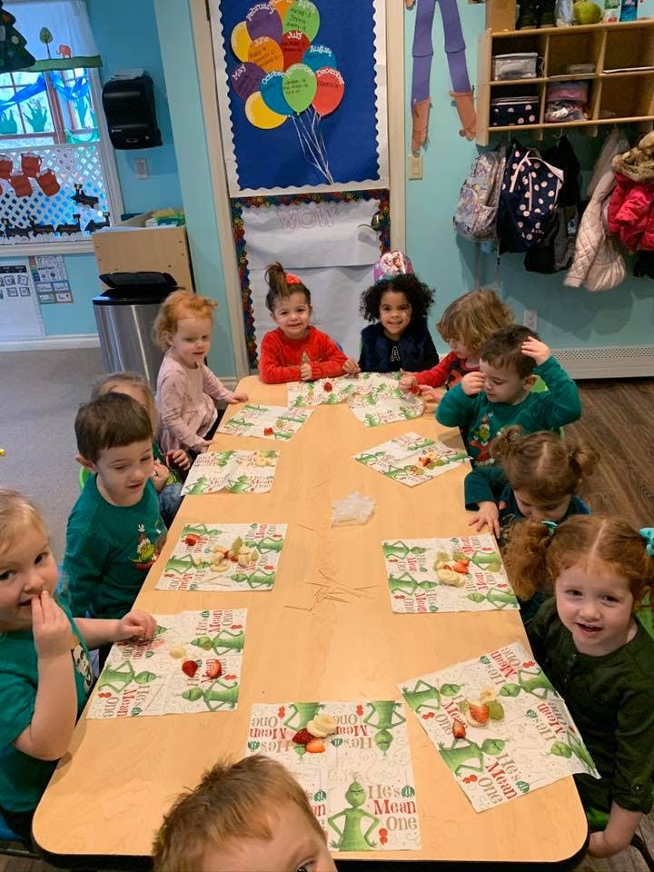 Children sitting at a table with placemats