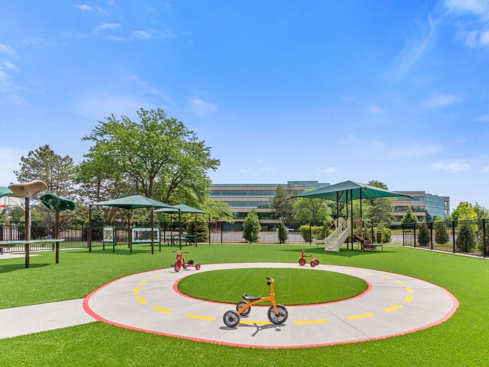 Outdoor children's playground with tricycles on a painted track