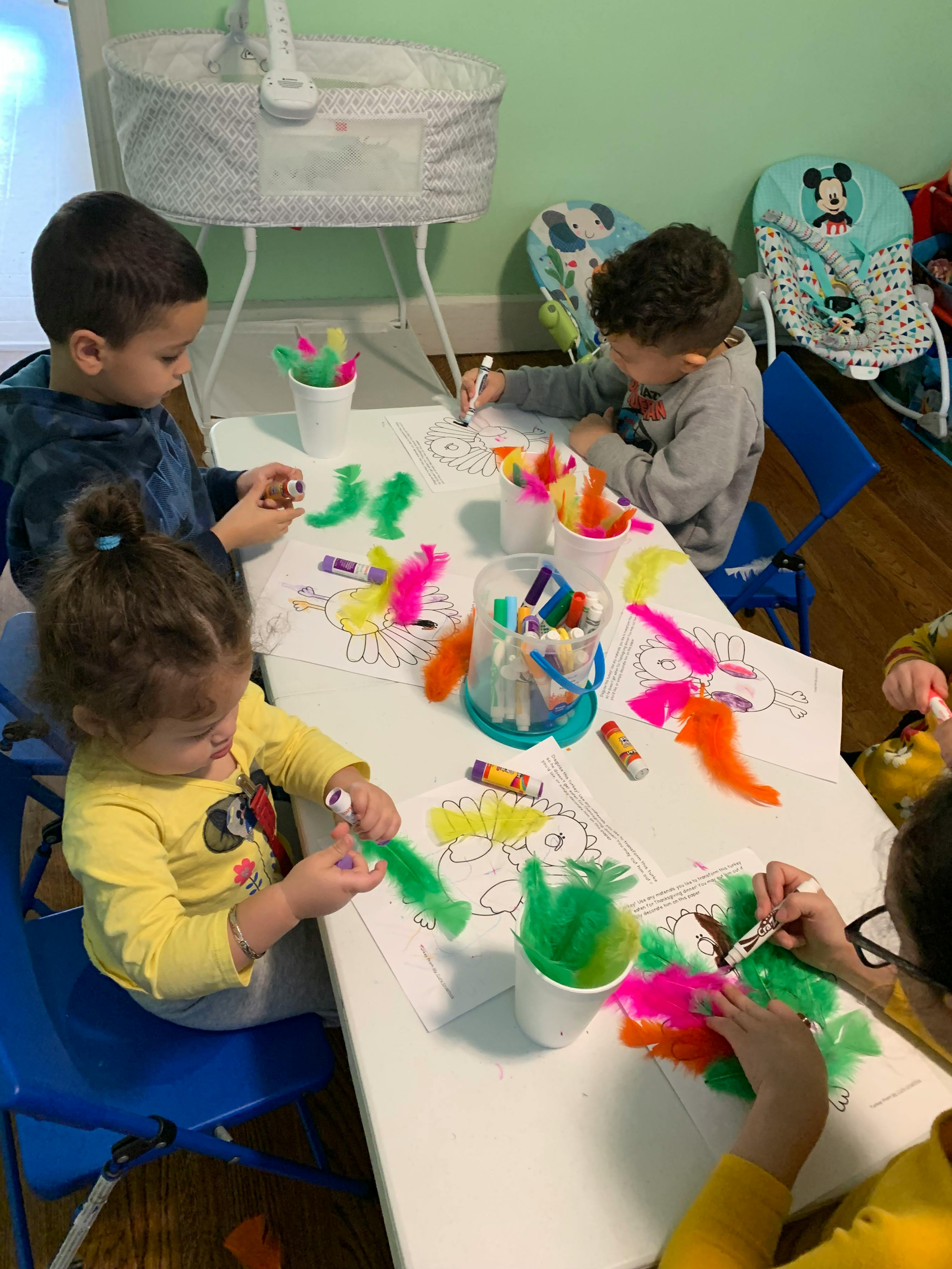 Children doing crafts at a table