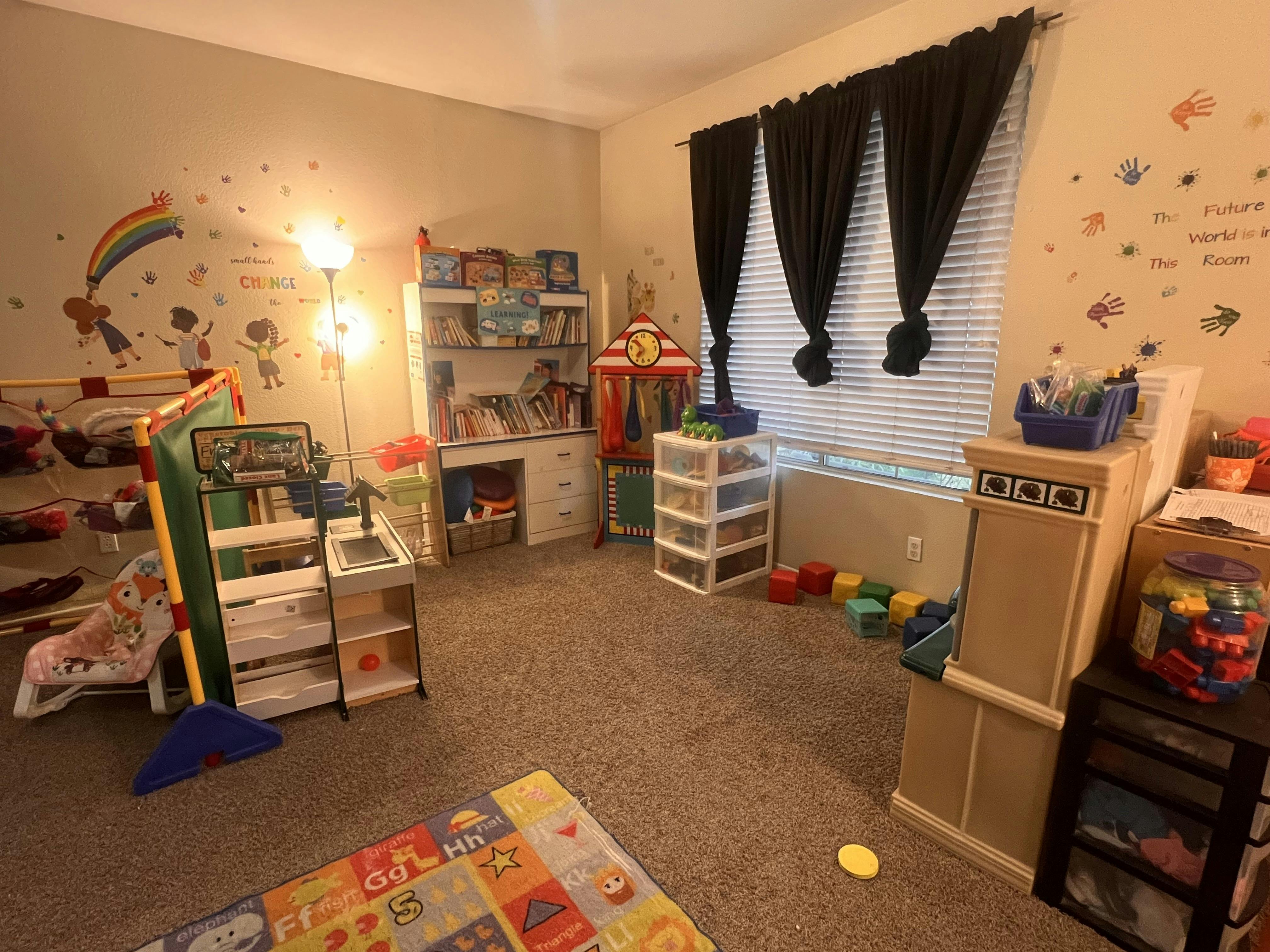 A room full of children's play equipment and learning materials