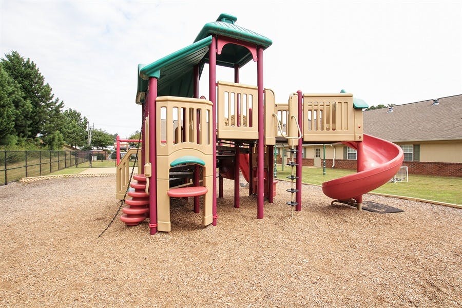 Playground structure with slides and climbing areas