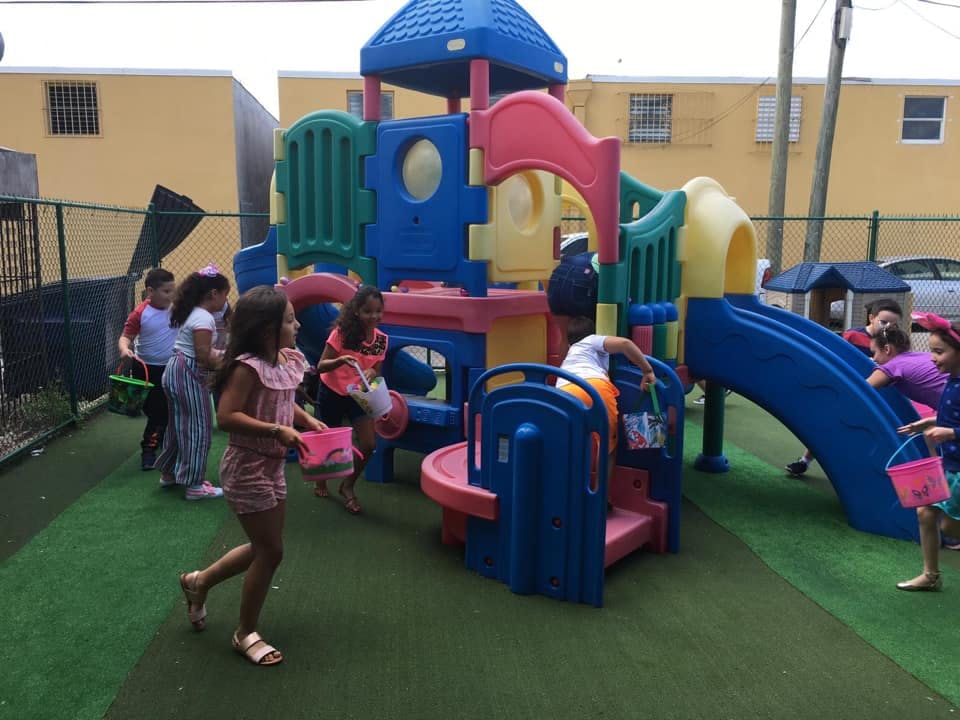 Children playing on a colorful playground structure