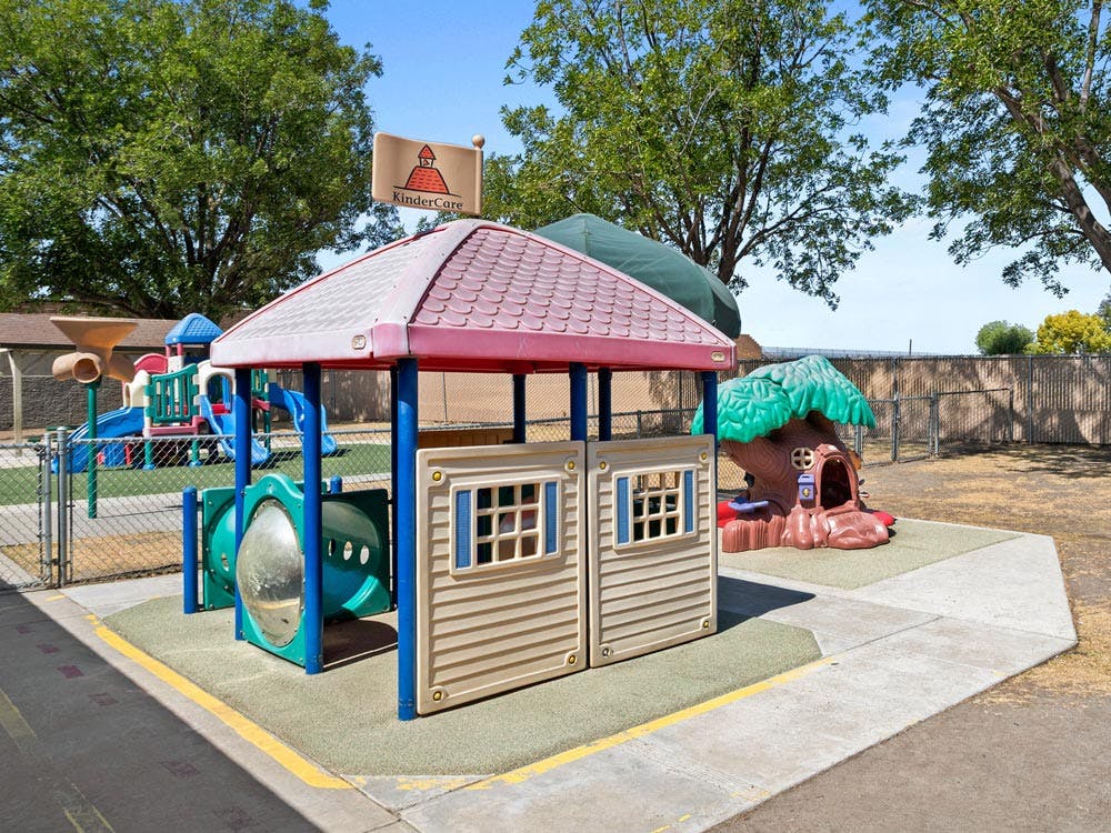 Empty children's playground with a KinderCare sign