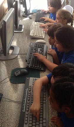 Children using computers in a classroom