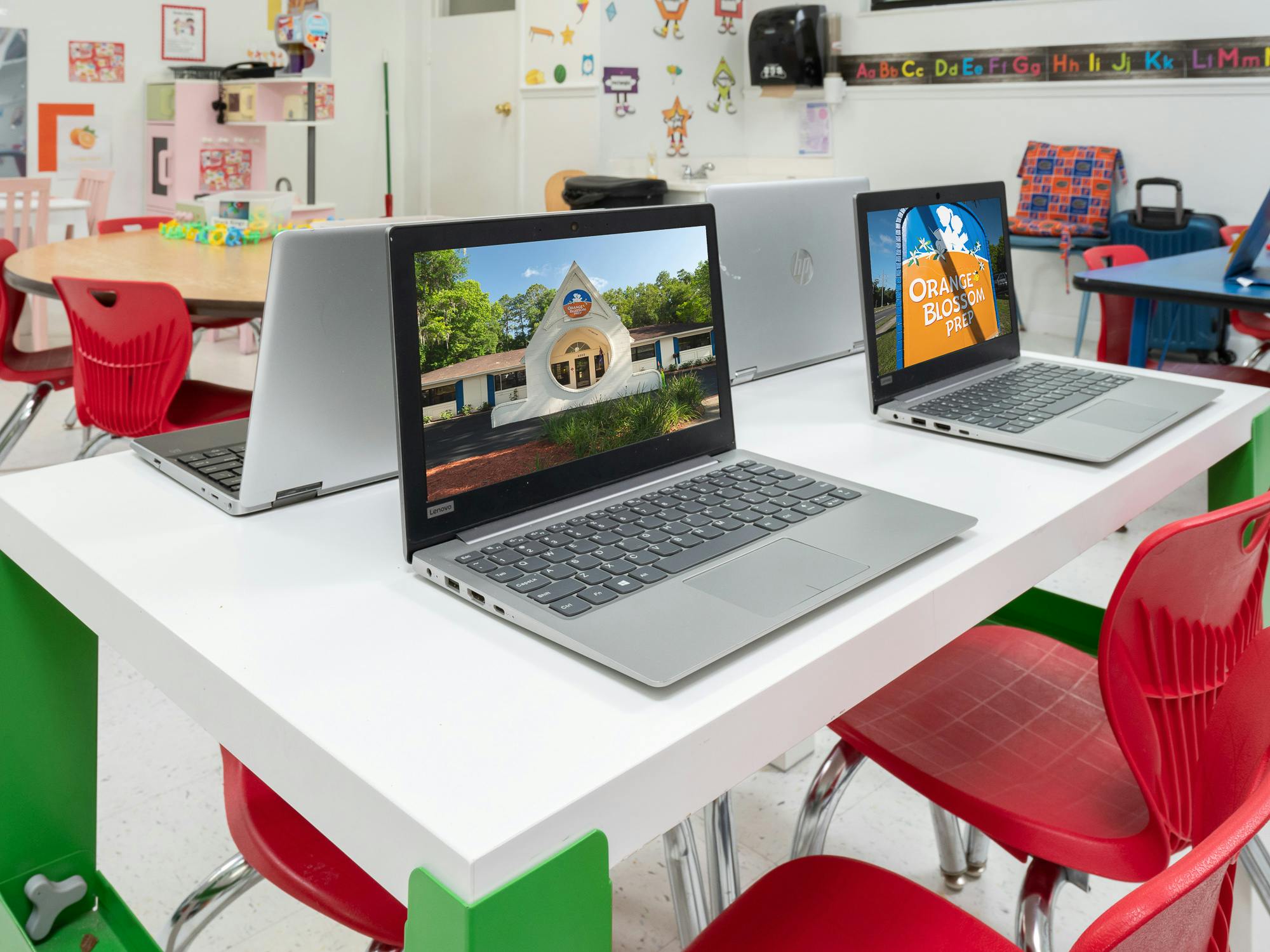 Laptops on desks in a classroom