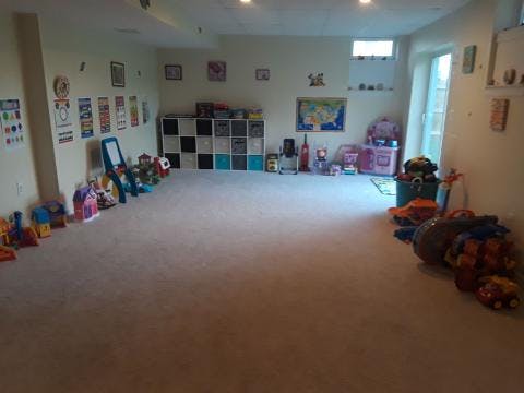 Playroom with toys and storage shelves