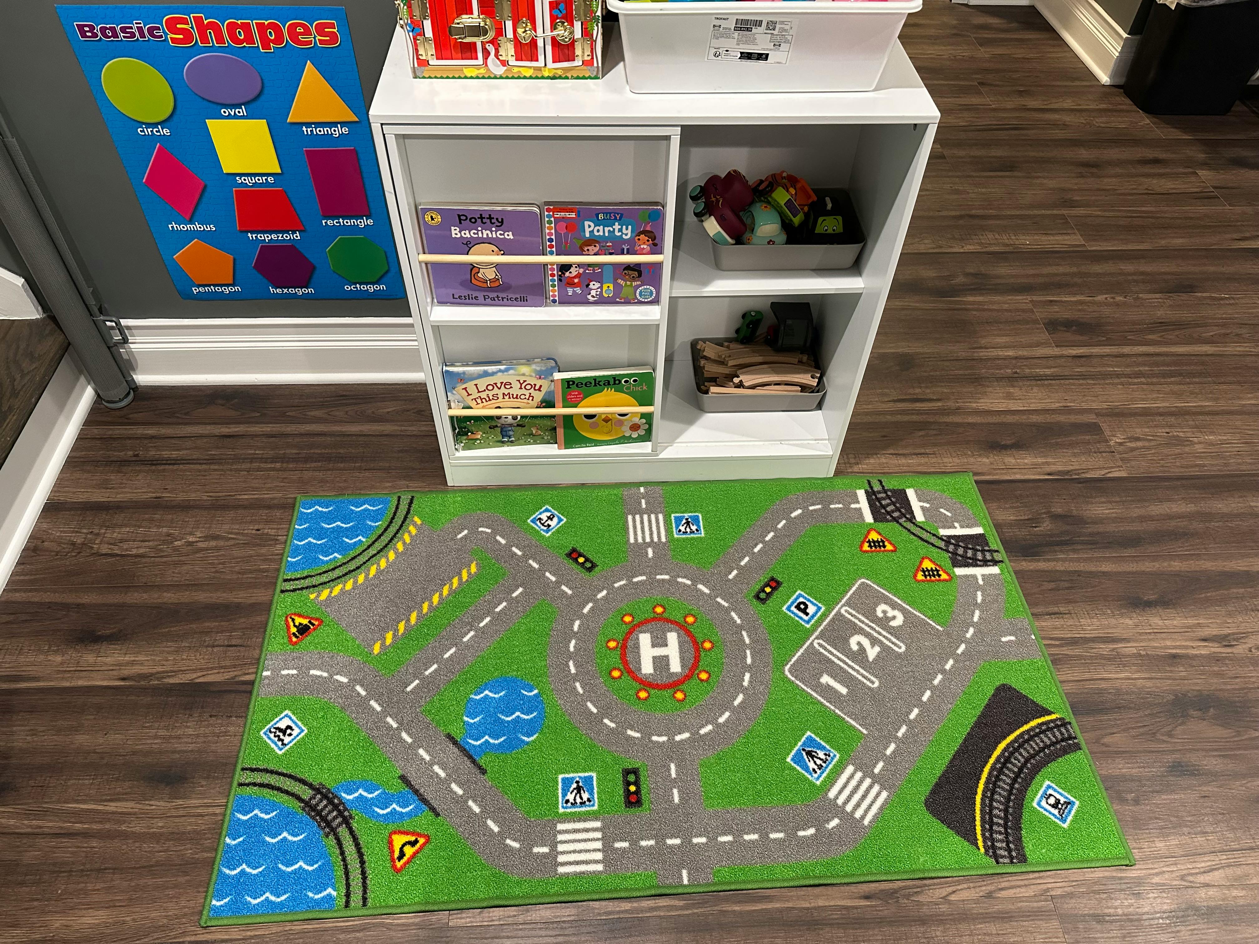 Playmat with roads and buildings on a wooden floor