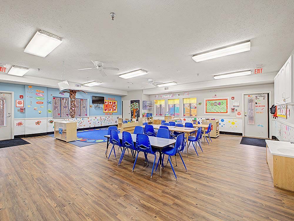 Classroom with blue chairs and tables