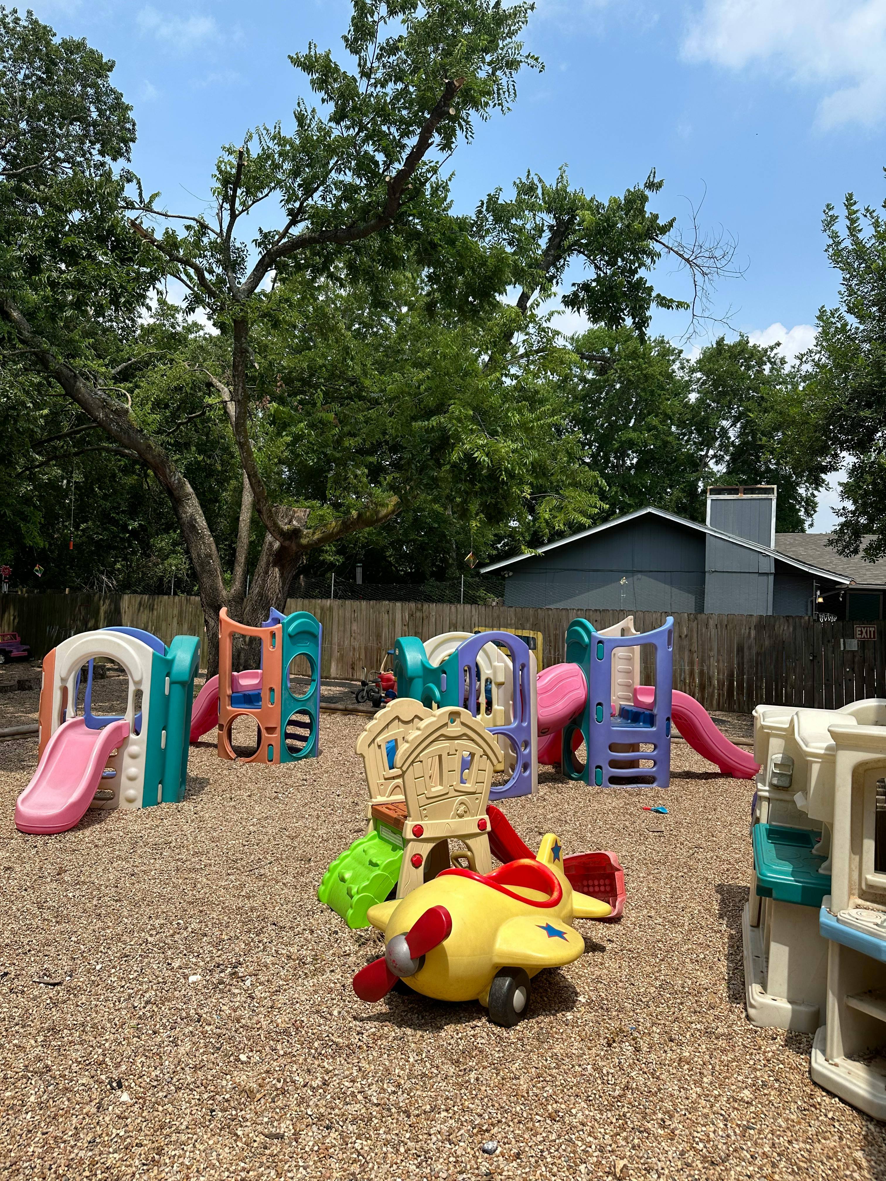 Outdoor playground with multiple colorful slides and play structures