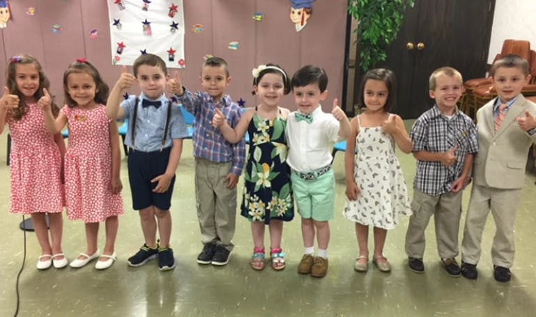 Group of children standing and posing