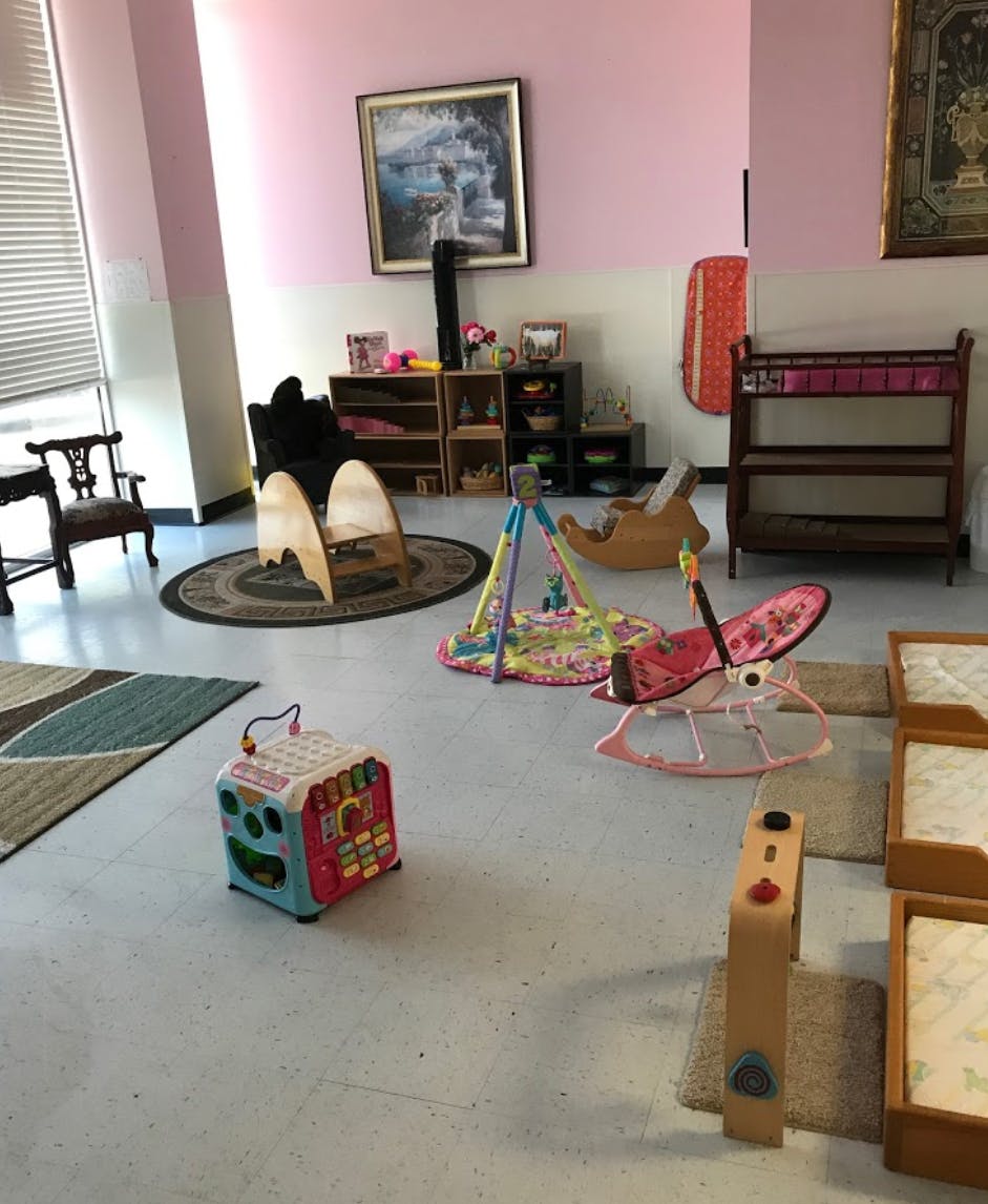 Playroom with various baby and toddler toys and furniture