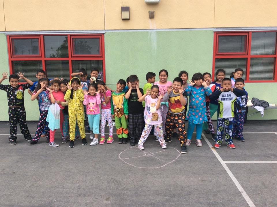 Group of children in pajamas standing outdoors