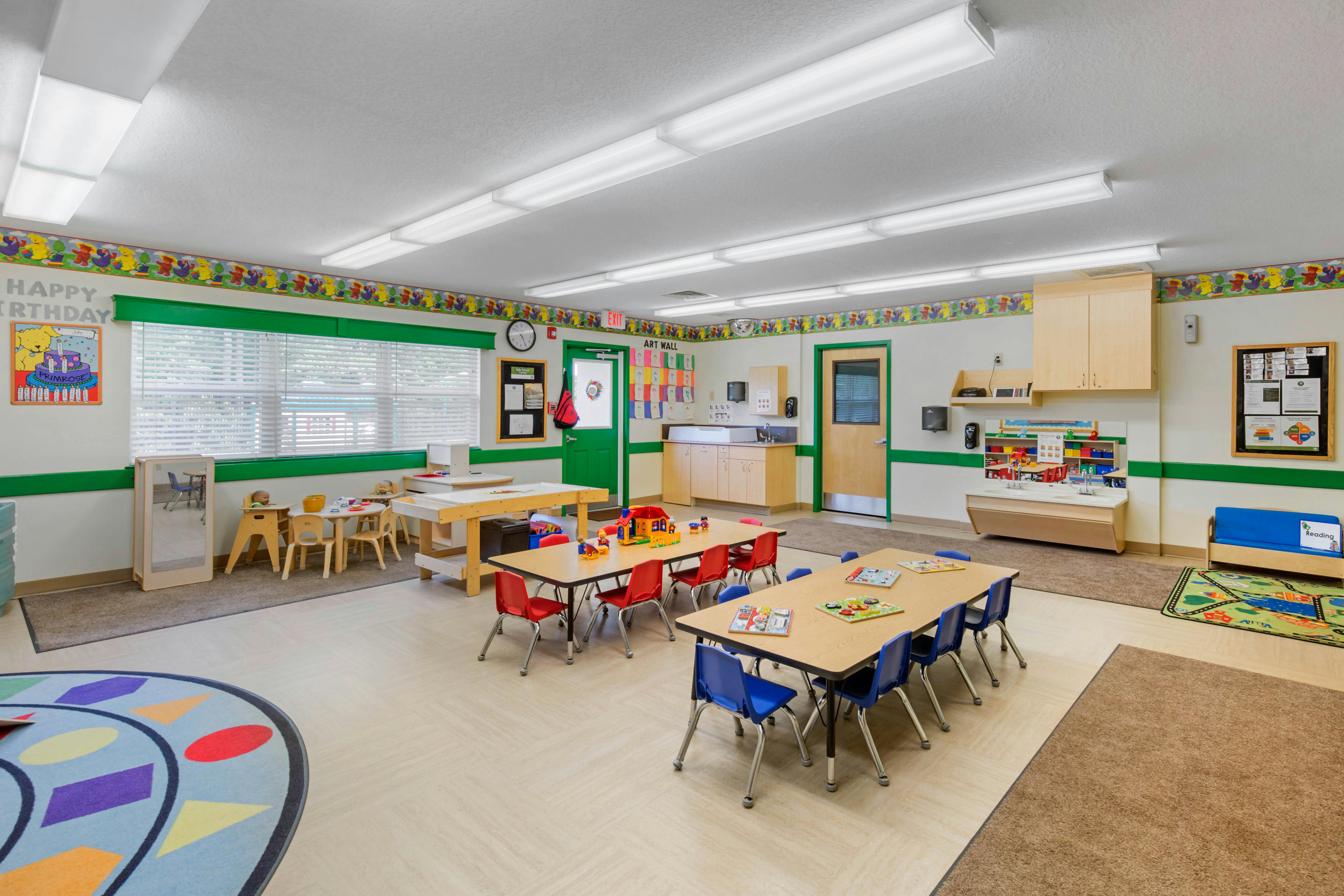 Classroom with multiple activity tables and chairs