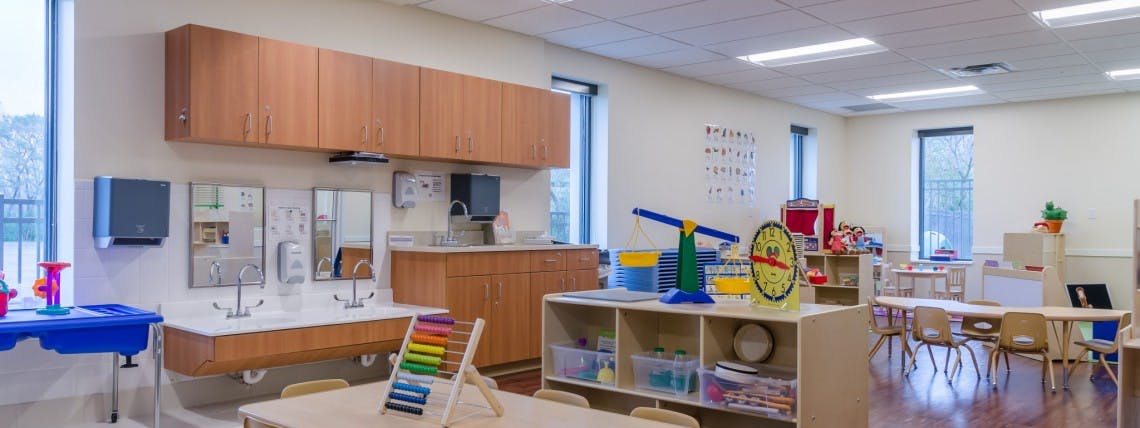 Classroom with sinks, cabinets, and various learning materials